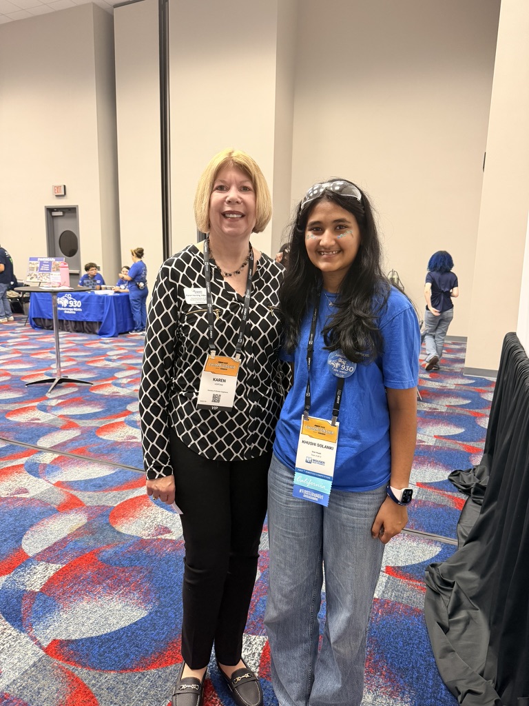 Khushi with SWE CEO Karen Horting at a robotics event