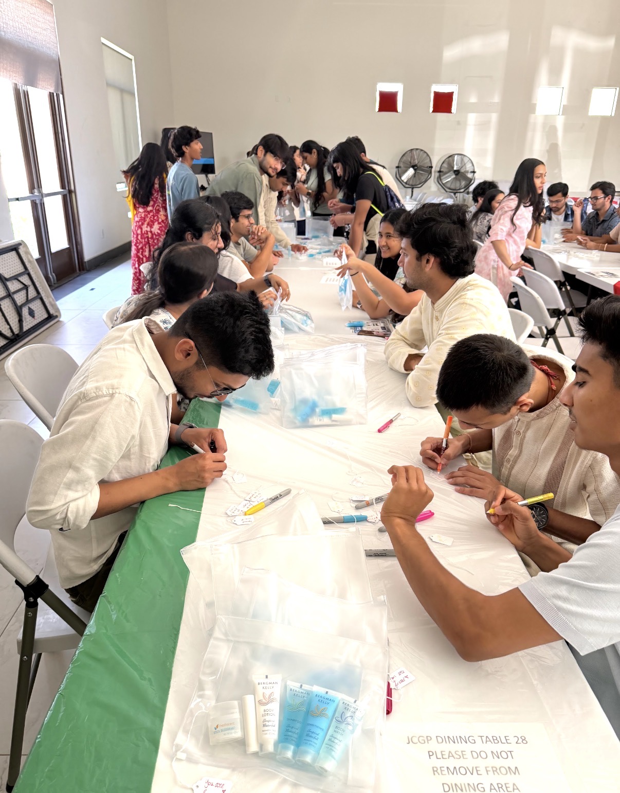 YJA service event with volunteers preparing care items